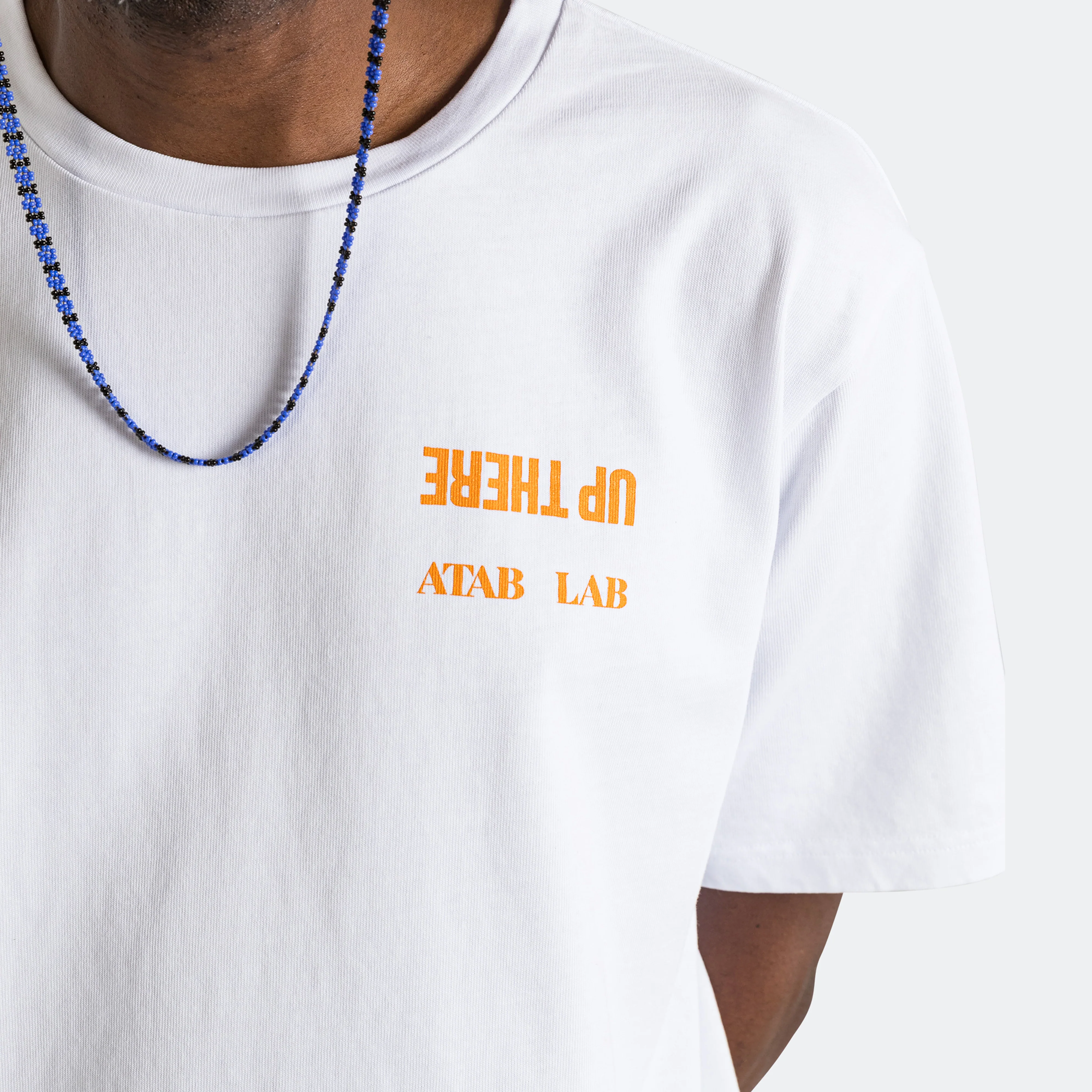 UP THERE X ATAB Lab 'Chess Man' Tee - White/Tangelo - Image 6